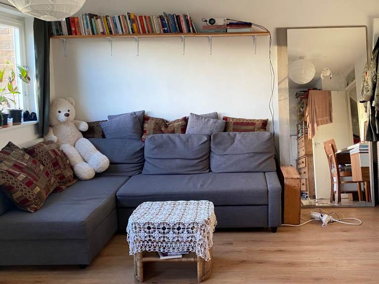 IKEA FRIHETEN Corner sofa-bed with storage and cushions in dark grey