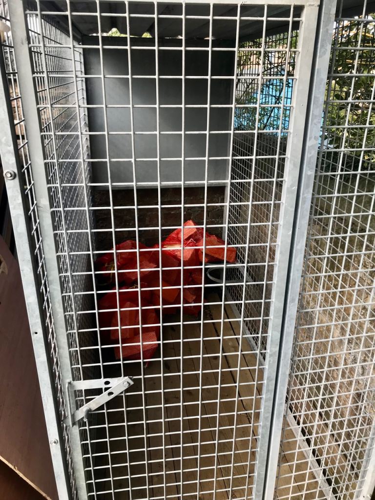 Dog run enclosed with corrugated roof 