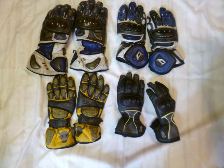 4 pairs of motorcycle gloves, all used. 2 mens and 2 ladies.