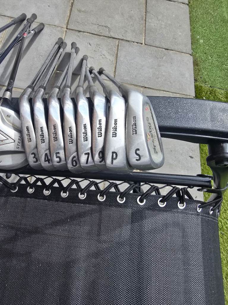 Set of golf clubs an stand bag