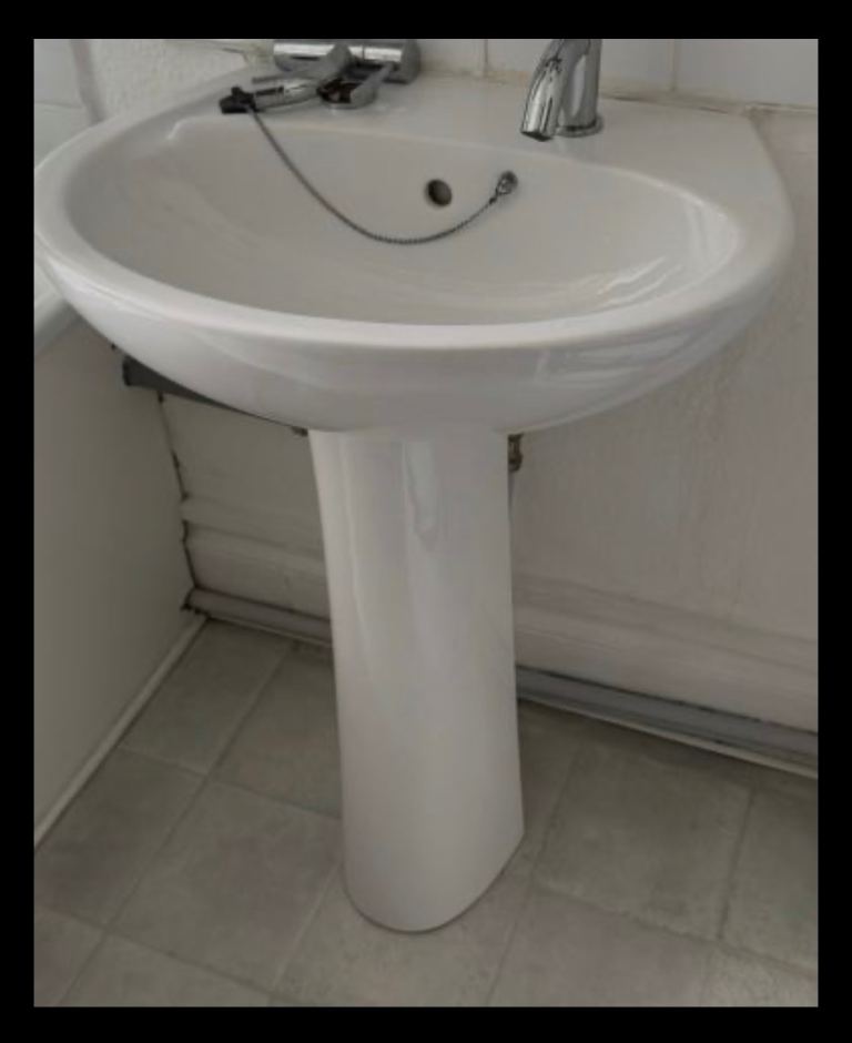White bathroom sink with pedestal