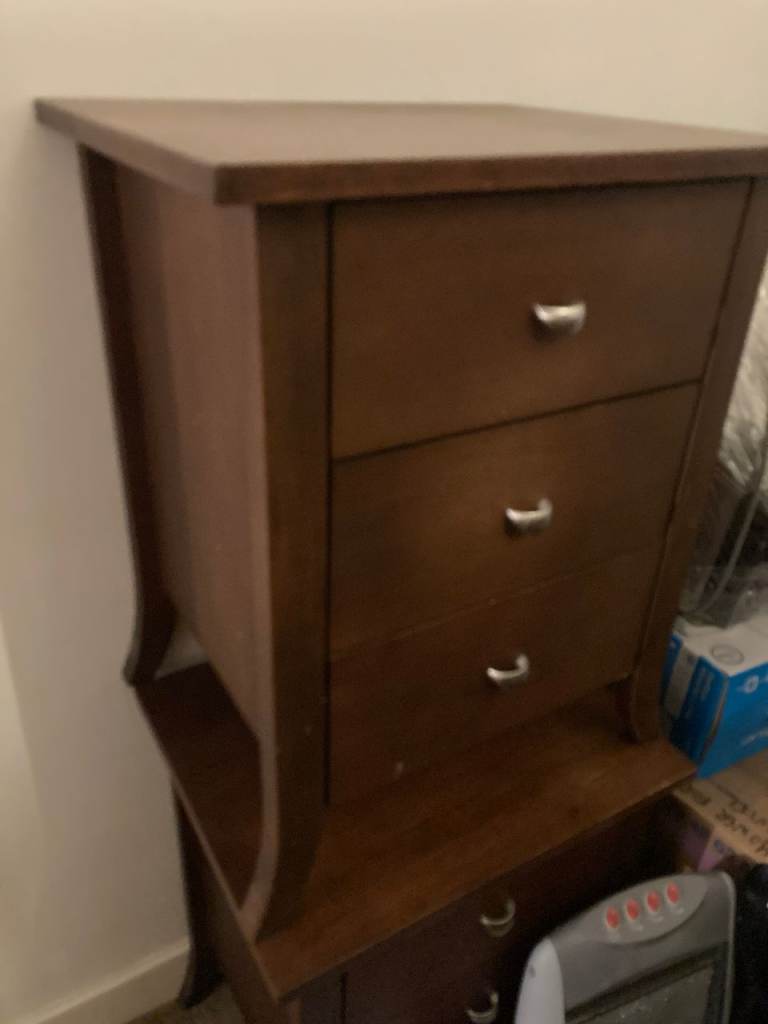A pair of good quality dark wood 3-drawer bedside cabinets