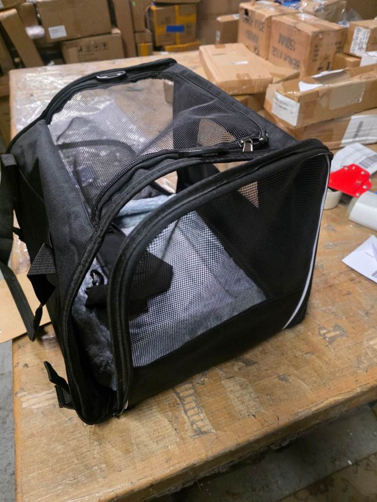 A new still packed black Pet Carrier  Folding Breathable Pet Travel Carry Bag 