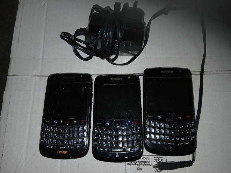 3 blackberry mobile spare and repairs and a charger 