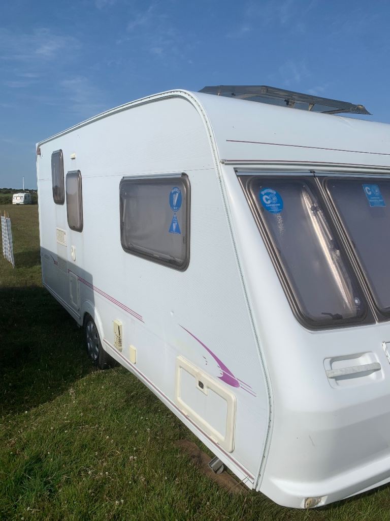 Caravan with awning 2002 2 Berth middle toilet Fleetwood Colchester420-2 