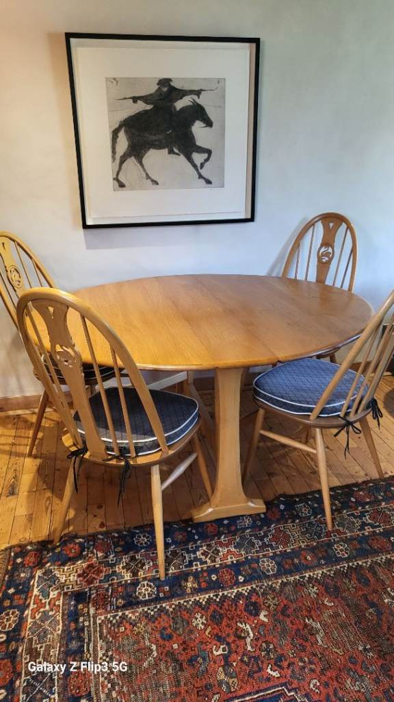 Ercol, round drop-leaf dining table