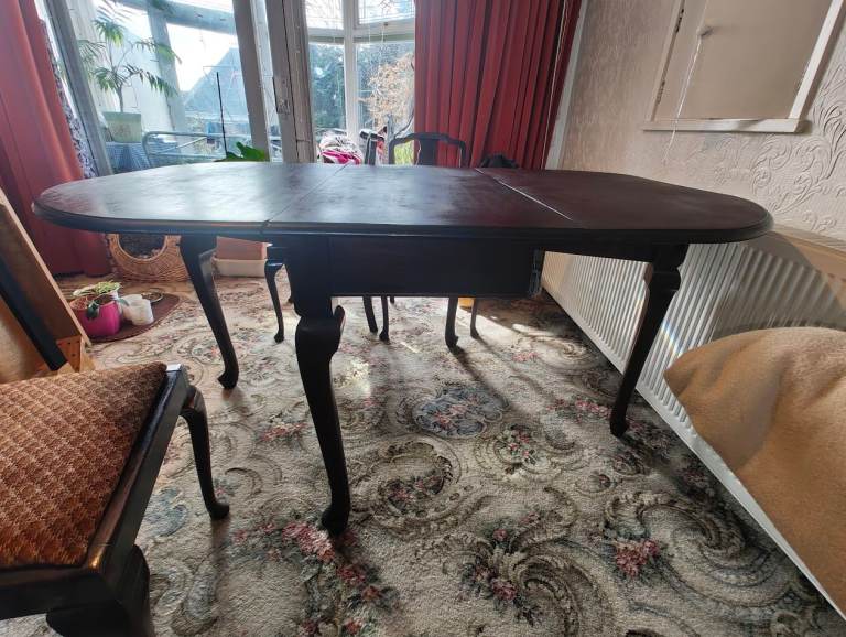 Dark wooden dining table and 4 chairs