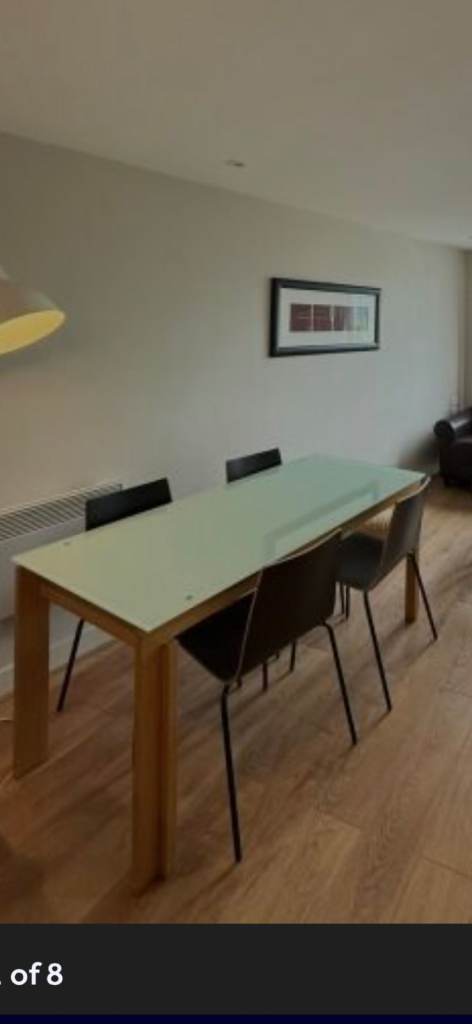 4 wooden brown chairs and glass dining table 