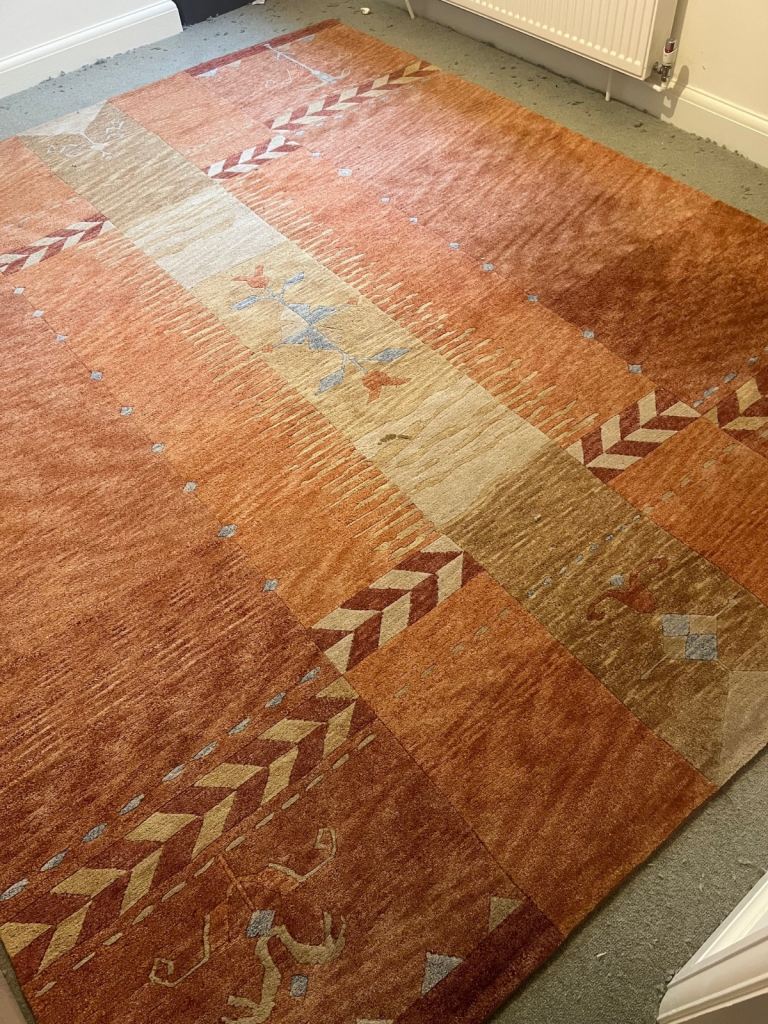 Lovely warm terracotta colours rug Large