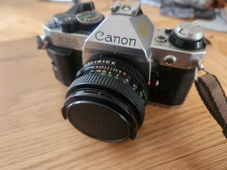 Canon AE-1 Program 35mm film camera with Canon FD 50mm f/1.8 lens.