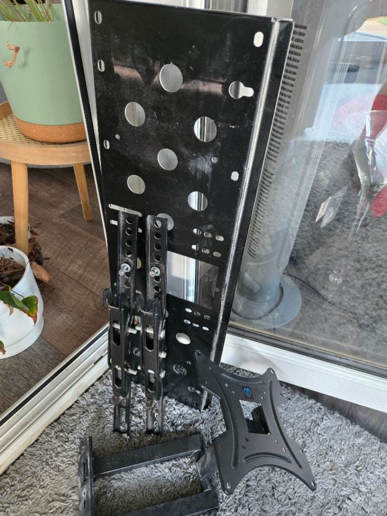 2 x TV Wall Brackets. 1 x fixed (adjusts up and down), 1 x Adjustable.