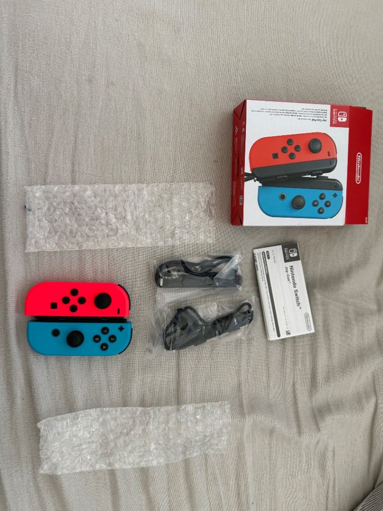 Brand new Nintendo switch Joycons pair red and blue 