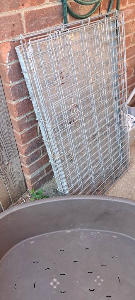 Large plastic dog bed and metal cage 