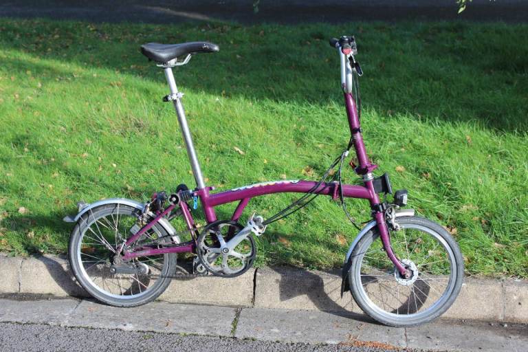 image for A Brompton bike in good condition , working dynamo and lights. Rare purple colour - collectible