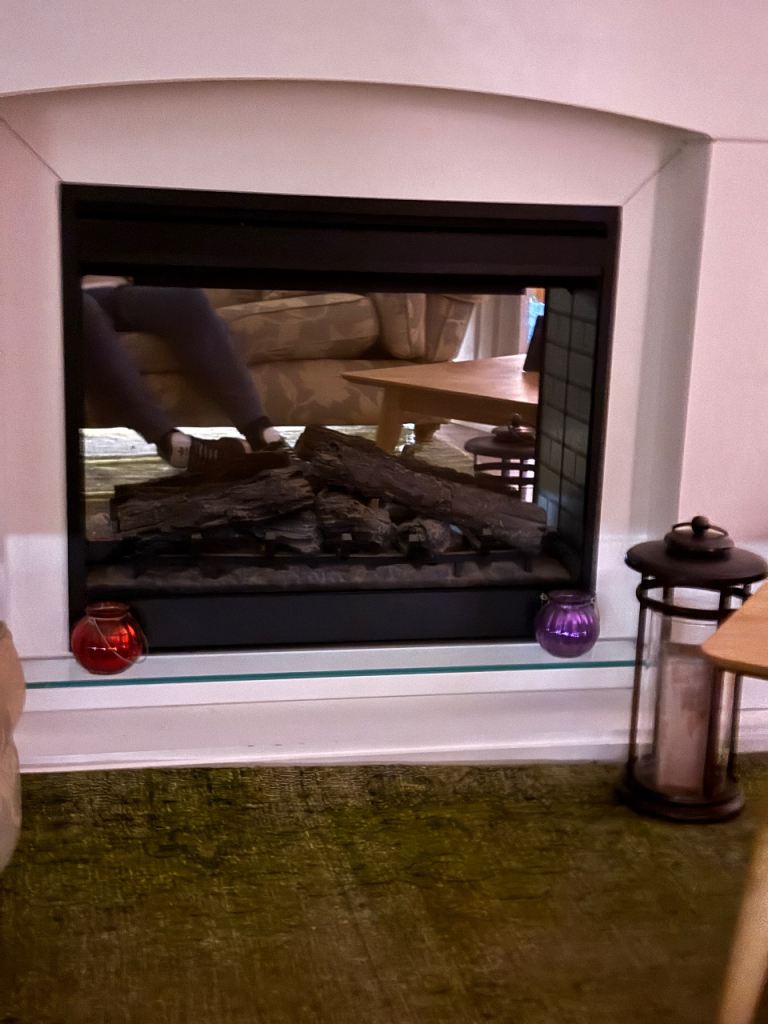 Modern fire and surround, with glass top shelf