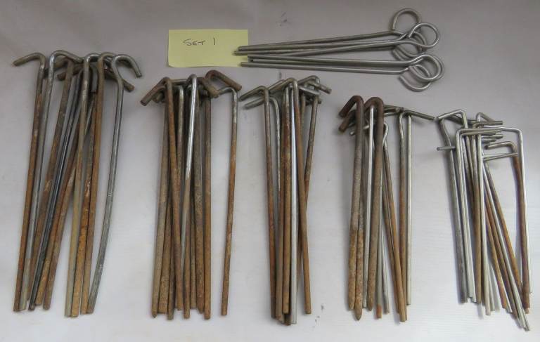 50+ metal tent pegs, 5in to 9in, good used condition.