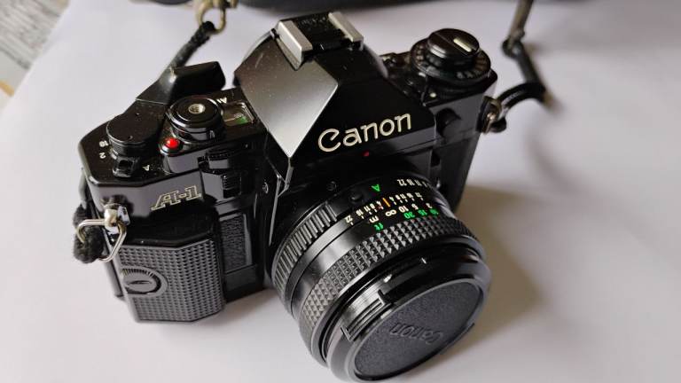 Canon A-1 SLR film camera outfit
