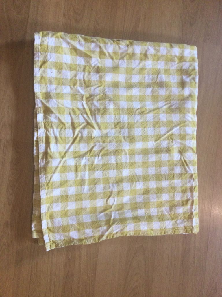 Mustard yellow and white checkered Next tablecloth