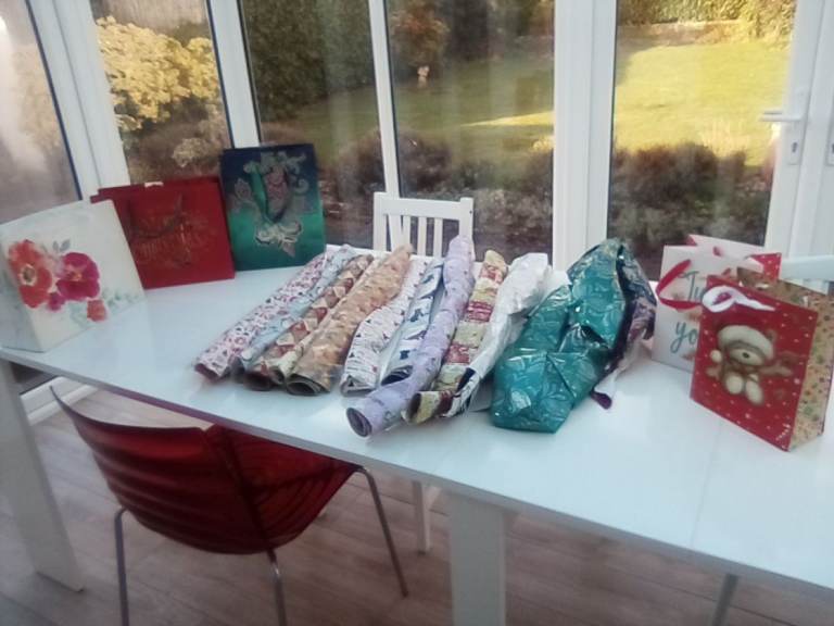 A bumper assortment of unused Christmas and other wrapping paper, and gift bags.