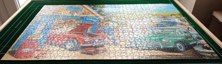FX Schmid 1000 Piece Jigsaw At The Garage by Trevor Mitchell