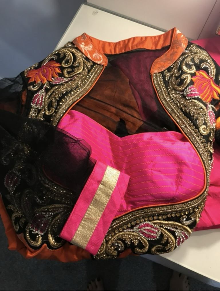 Indian suit in black net, orange and pink