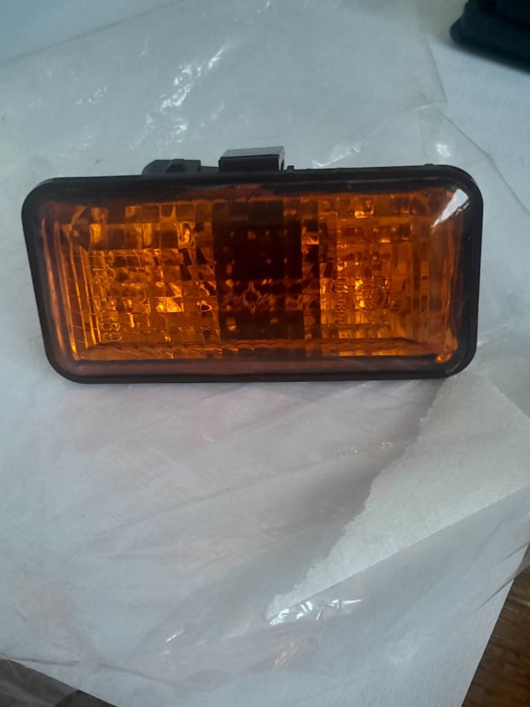 Side repeater flasher lamp amber lens.