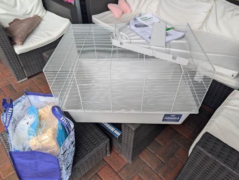 Hamster cage, water bottle, straw, food, etc