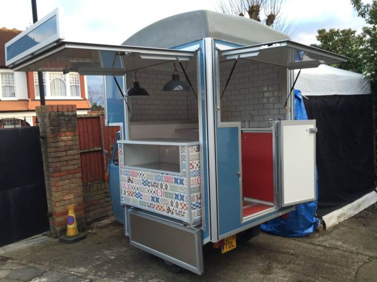 The bright and vibrant 1989 vintage Ape Piaggio van has been converted into a food truck van in 2016