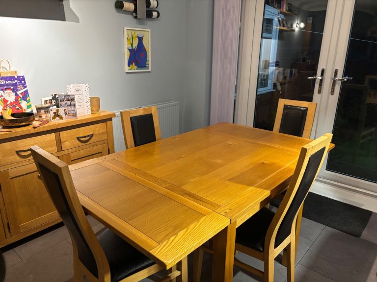 image for Solid oak dining table and 4 chairs 