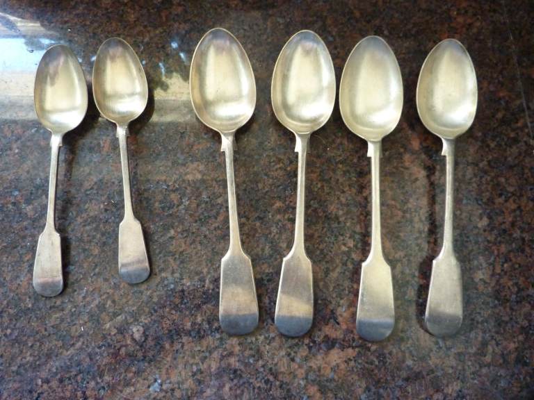 Four silver-plated tablespoons and two matching dessert spoons