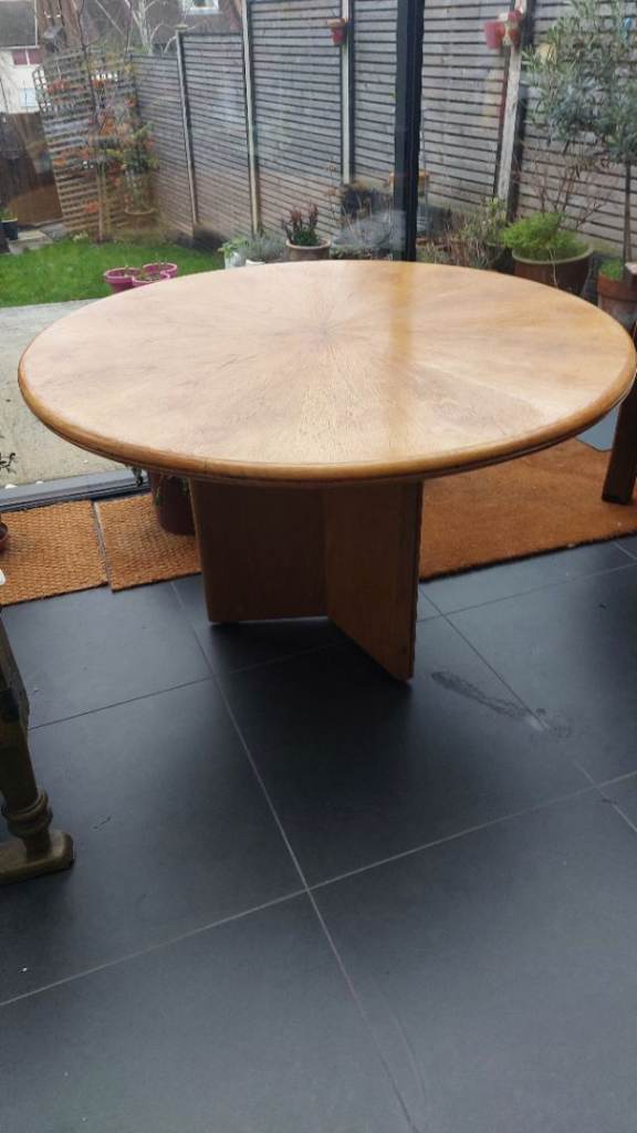 Circular wooden dining table 