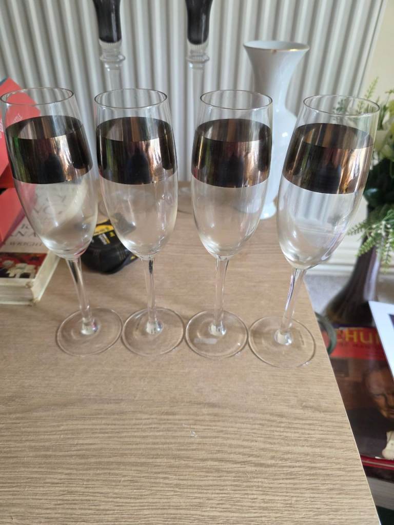 Four gold rimmed wine gasses 