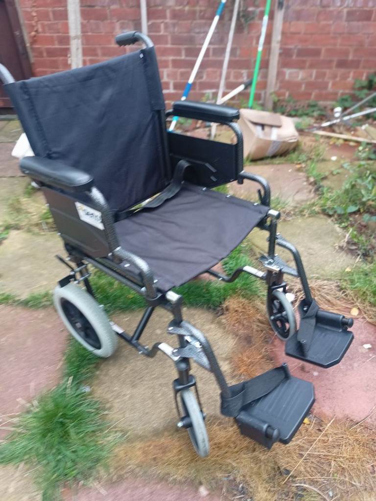 Folding Wheelchair in excellent condition with Padded Backrest and Seat can deliver 