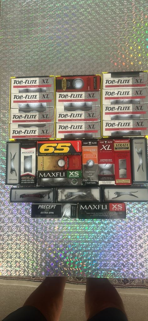 A MIXTURE OF 81 NEW GOLF BALLS