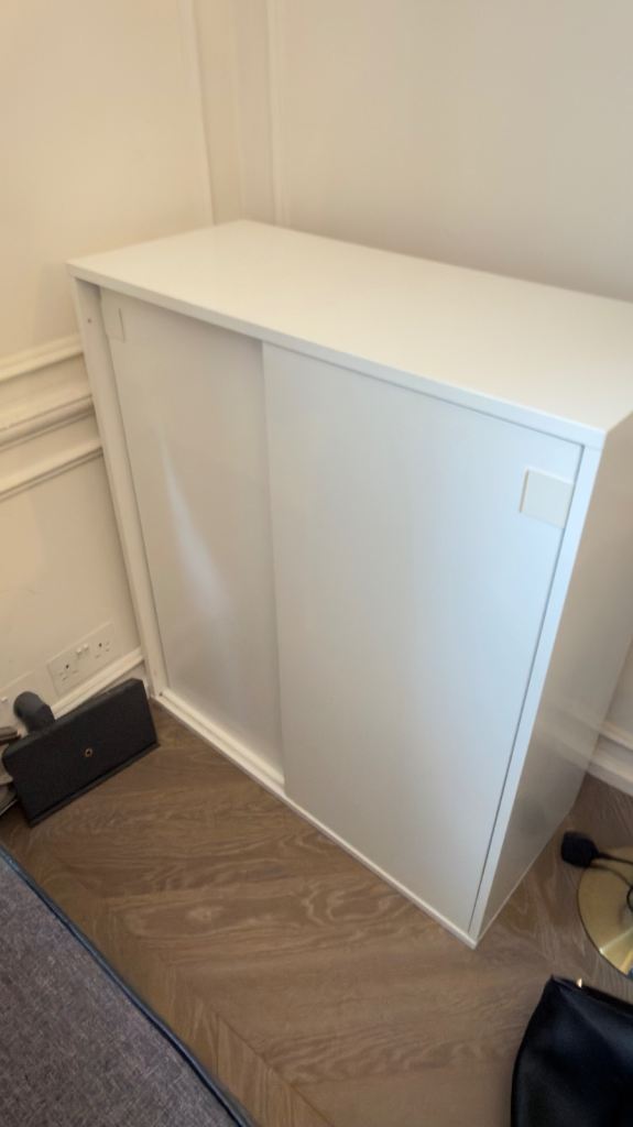 White Storage Cupboard with Sliding Doors – Good Condition