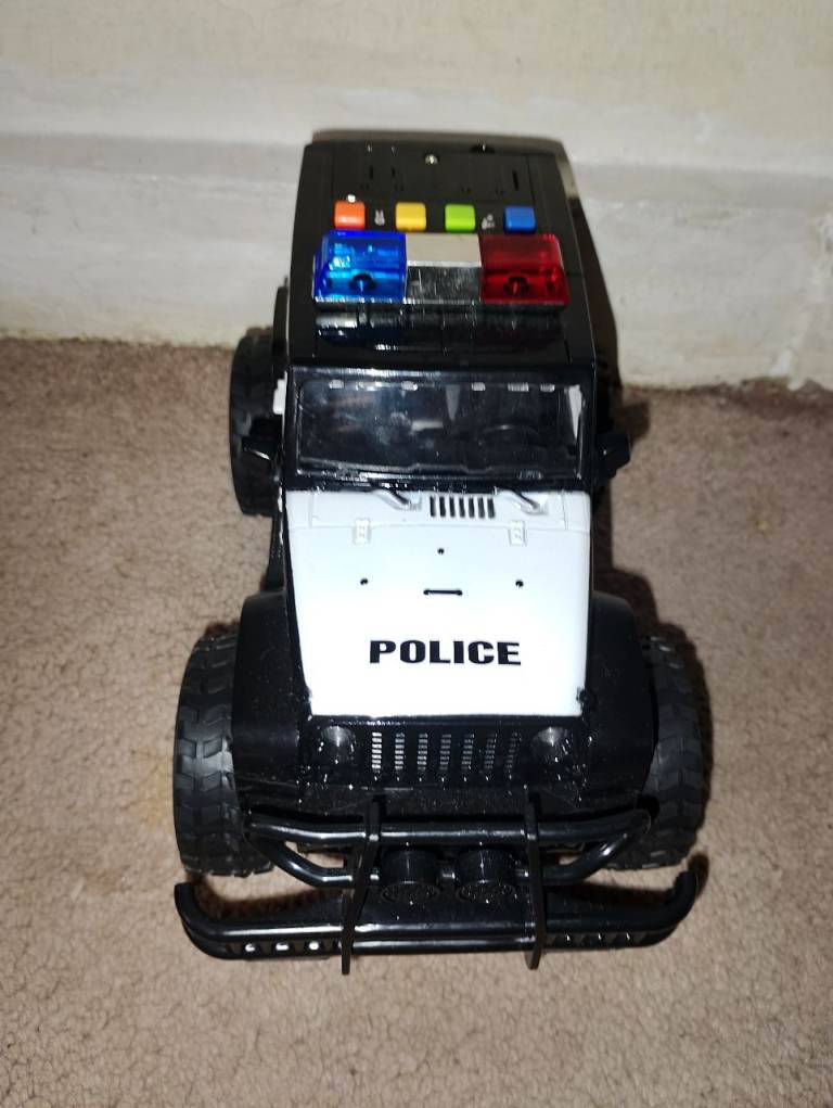 Toy police car lights up  and makes police spunds