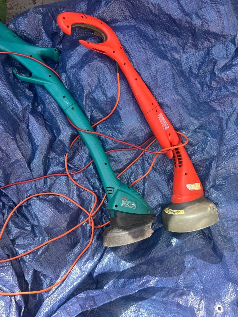 Pair of Electric Grass Trimmers – Red and Green