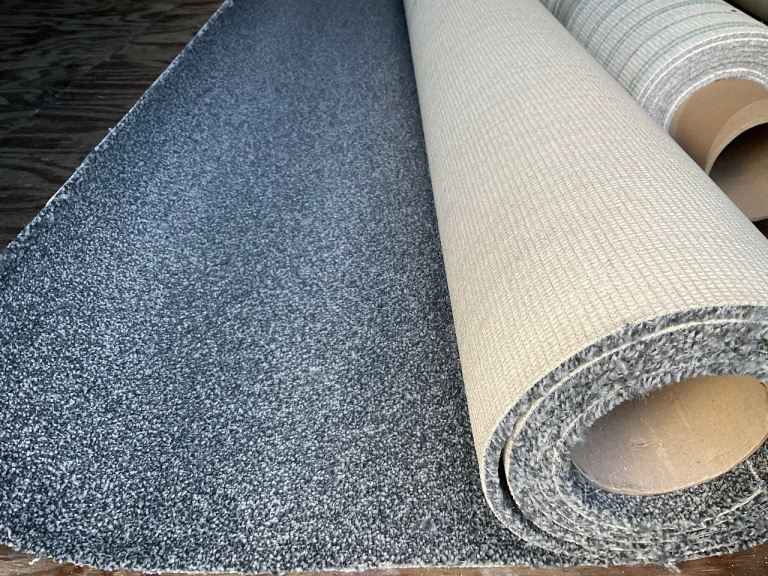 A new 3.05 x 4m dark grey carpet.