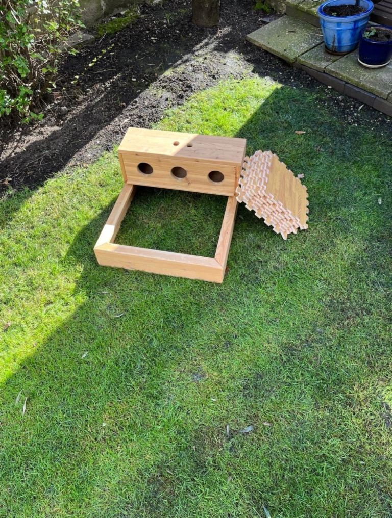 rabbit hay rack with water fountain