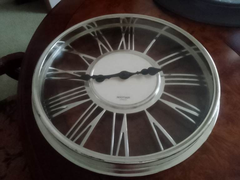 Pretty battery clock   40 cms dial   appearance polished aluminium silver figures black fingers