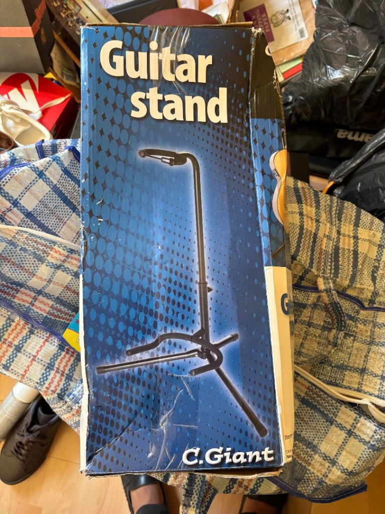 C. Giant Guitar Stand – good condition, in Box