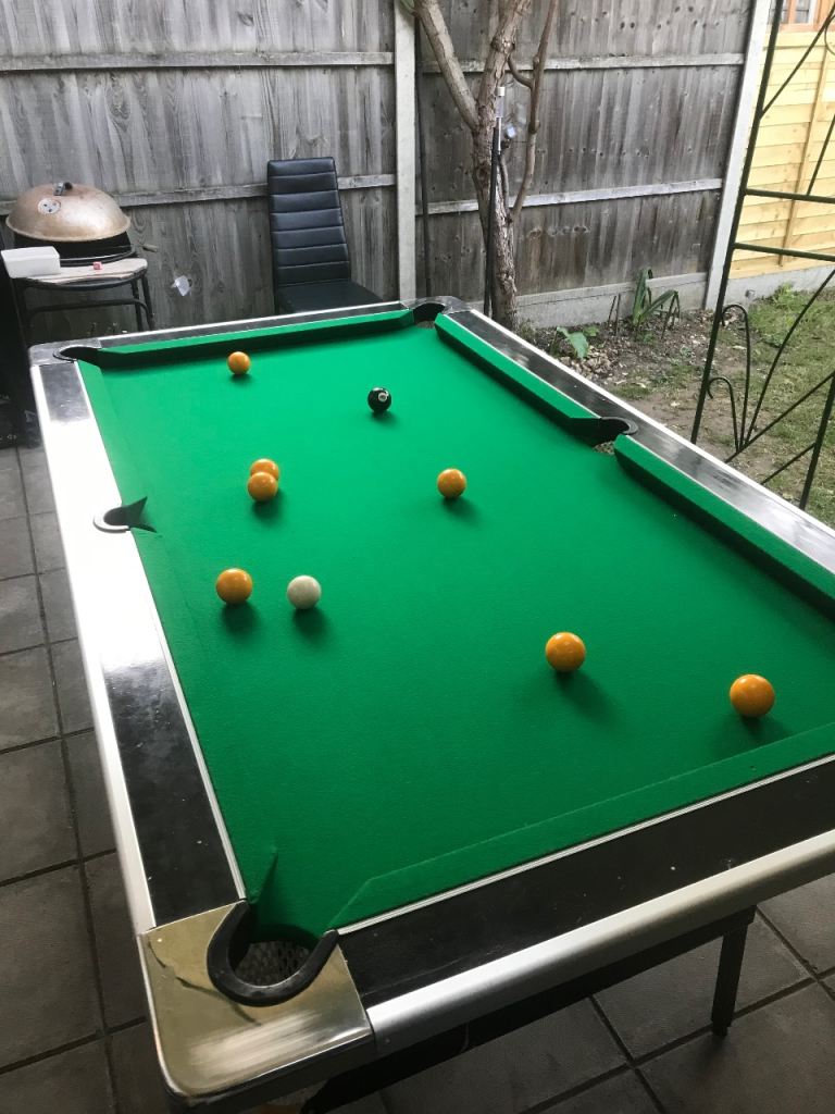 Pool table with cues and balls