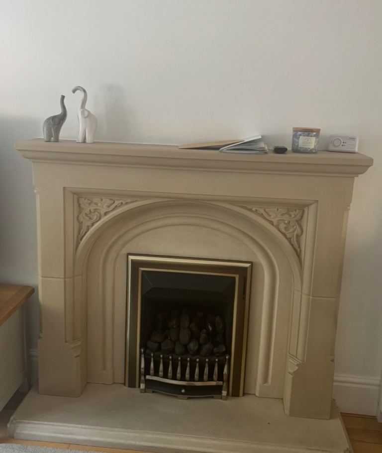 Fireplace surround with gold gas fire insert