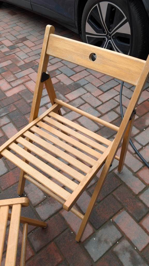 Extending solid wood table and folding chairs