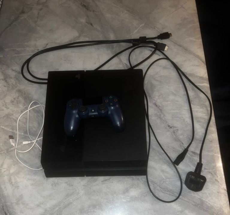 Sony PlayStation 4 Console with Controller and Cables – Good Condition