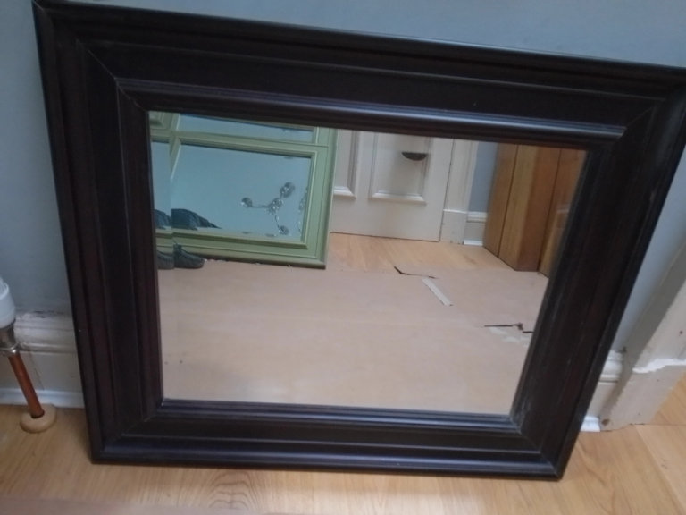 Medium size mirror with black frame