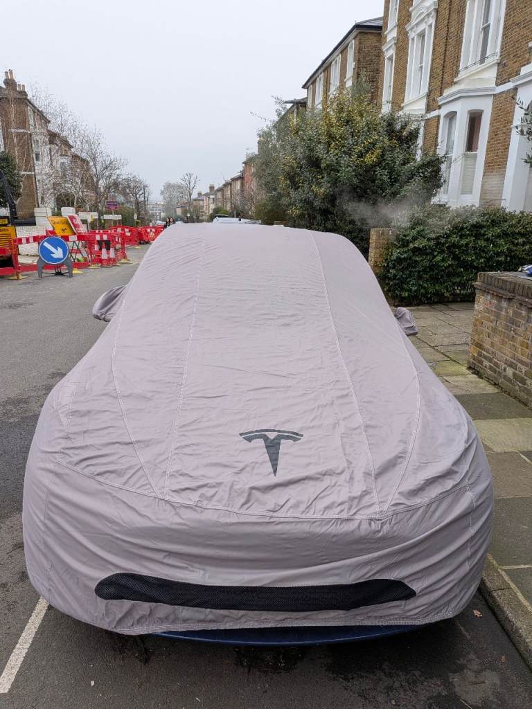Original Tesla Model Y cover as new