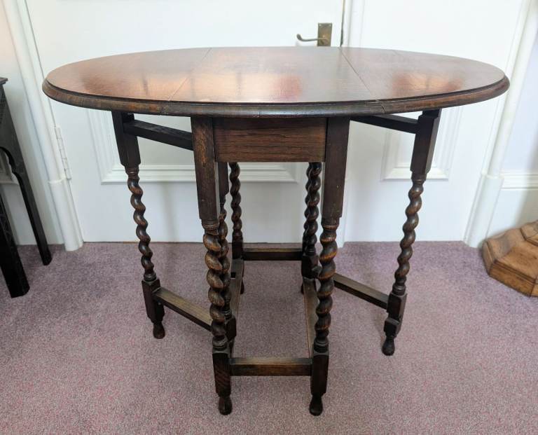Antique Drop Leaf Table with barley twist supports.