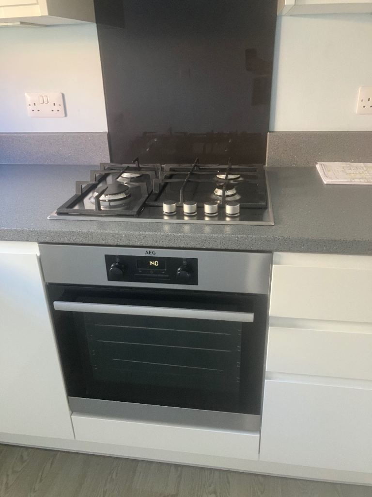 White high gloss kitchen with AEG appliances 