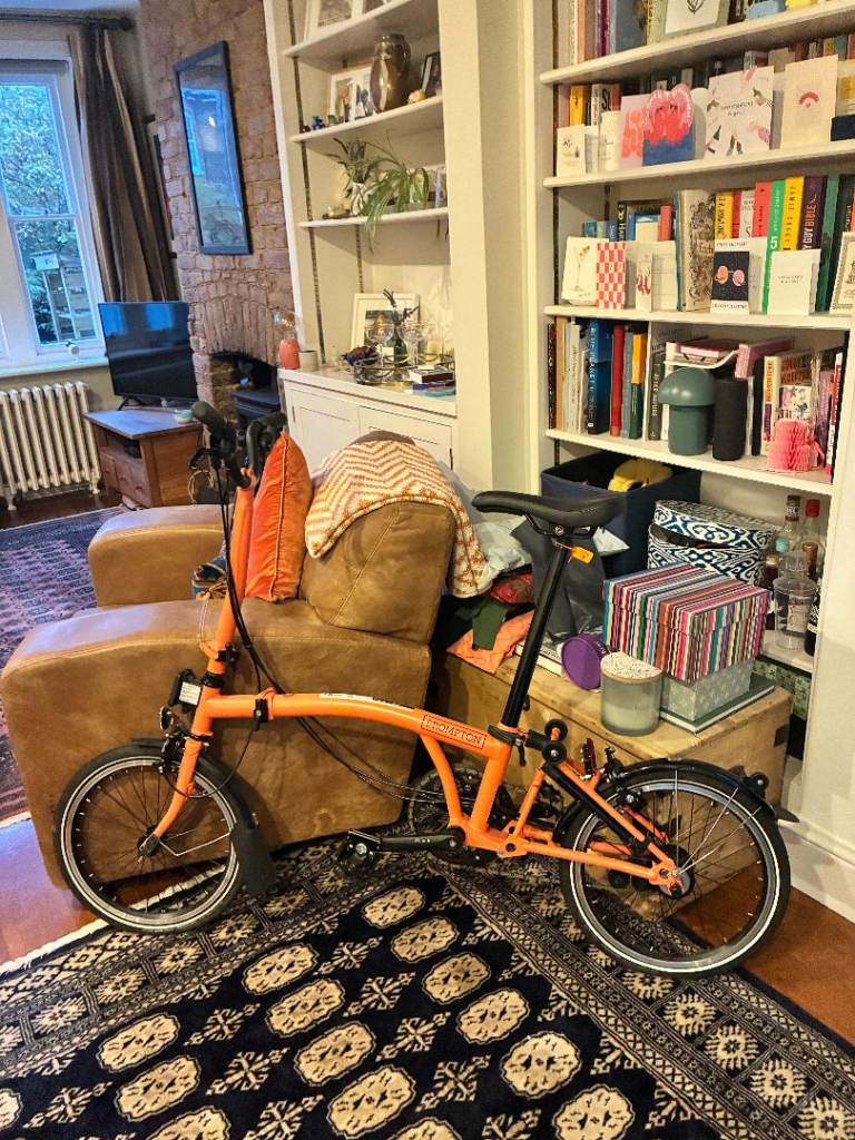 Brompton (unused) - orange, 6 speed C line, M bar, with bag for the front!